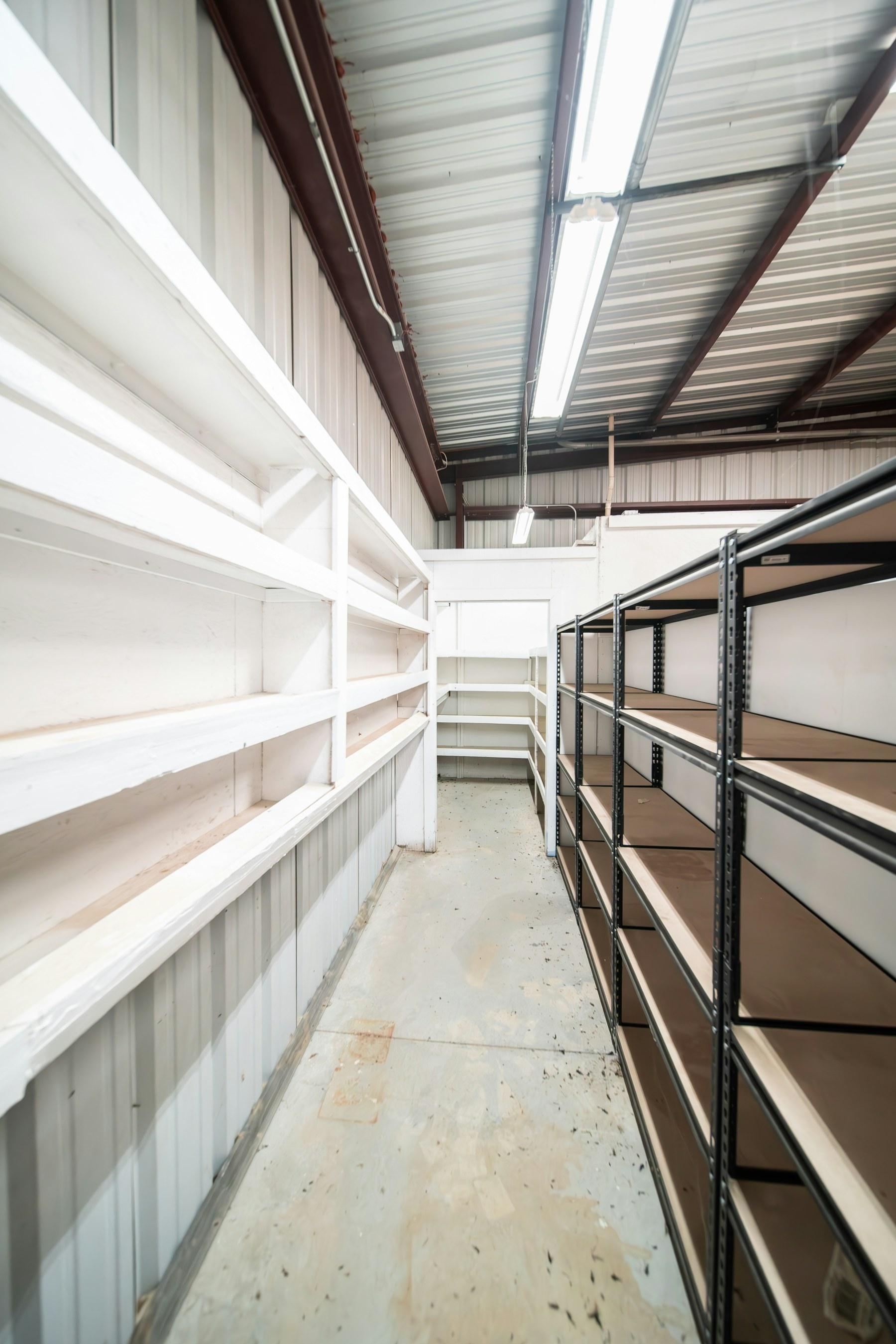 Warehouse shelves and operational space showing work that needs coordination.